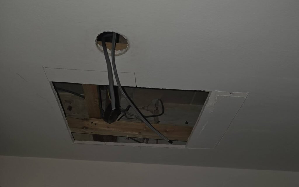 Kitchen ceiling opened to access damaged electrical wiring