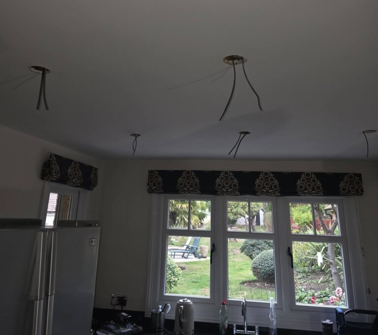 Kitchen ceiling with lighting cables positioned during electrical rewiring